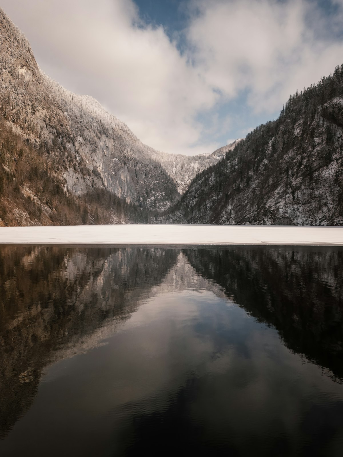 Mountain range reflected in a still, calm lake